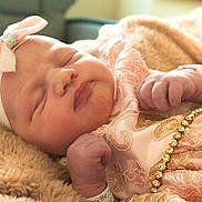 Emery is registered to the contest to win money with this photo: baby, newborn, sleeping, pink, bow, headband, bracelet, blanket, soft, cute, infant, closeup, peaceful, adorable, clothing, resting, hospital, tiny, portrait, child