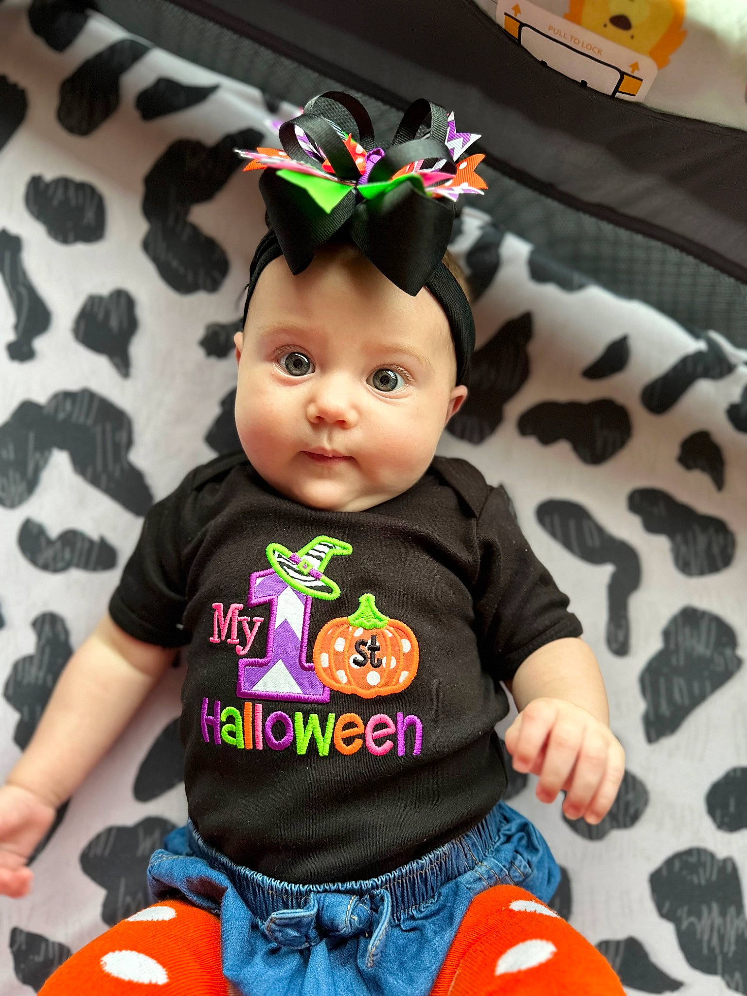 Lilly joined the competition — help win amazing prizes! baby, baby_toddler_clothing, black, cheek, child, costume_hat, denim, doll, fashion_accessory, fun, happy, jeans, orange, pattern, person, product, sitting, sleeve, t_shirt, textile