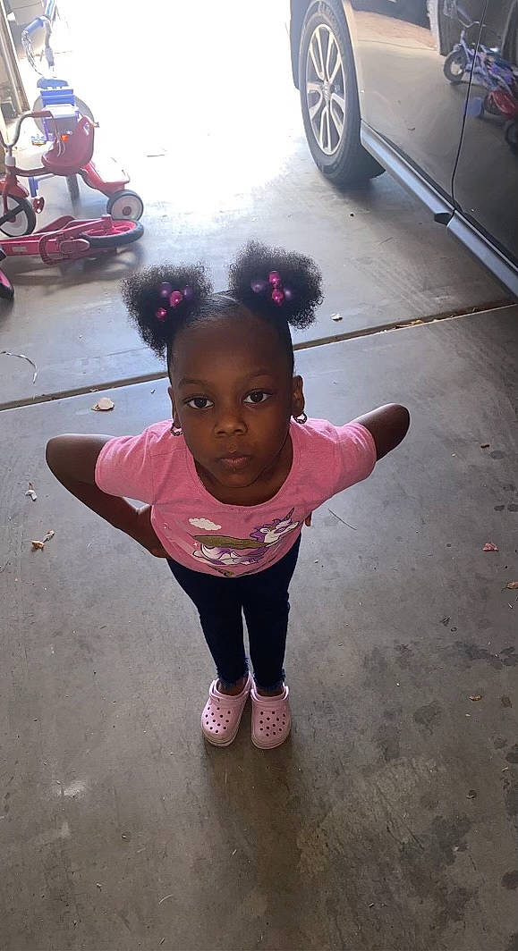 Brookelynn joined the competition — help win amazing prizes! asphalt, automotive_tire, child, flooring, fun, happy, leisure, magenta, person, personal_protective_equipment, pink, play, recreation, road, road_surface, sidewalk, standing, tire, toddler, vehicle_door