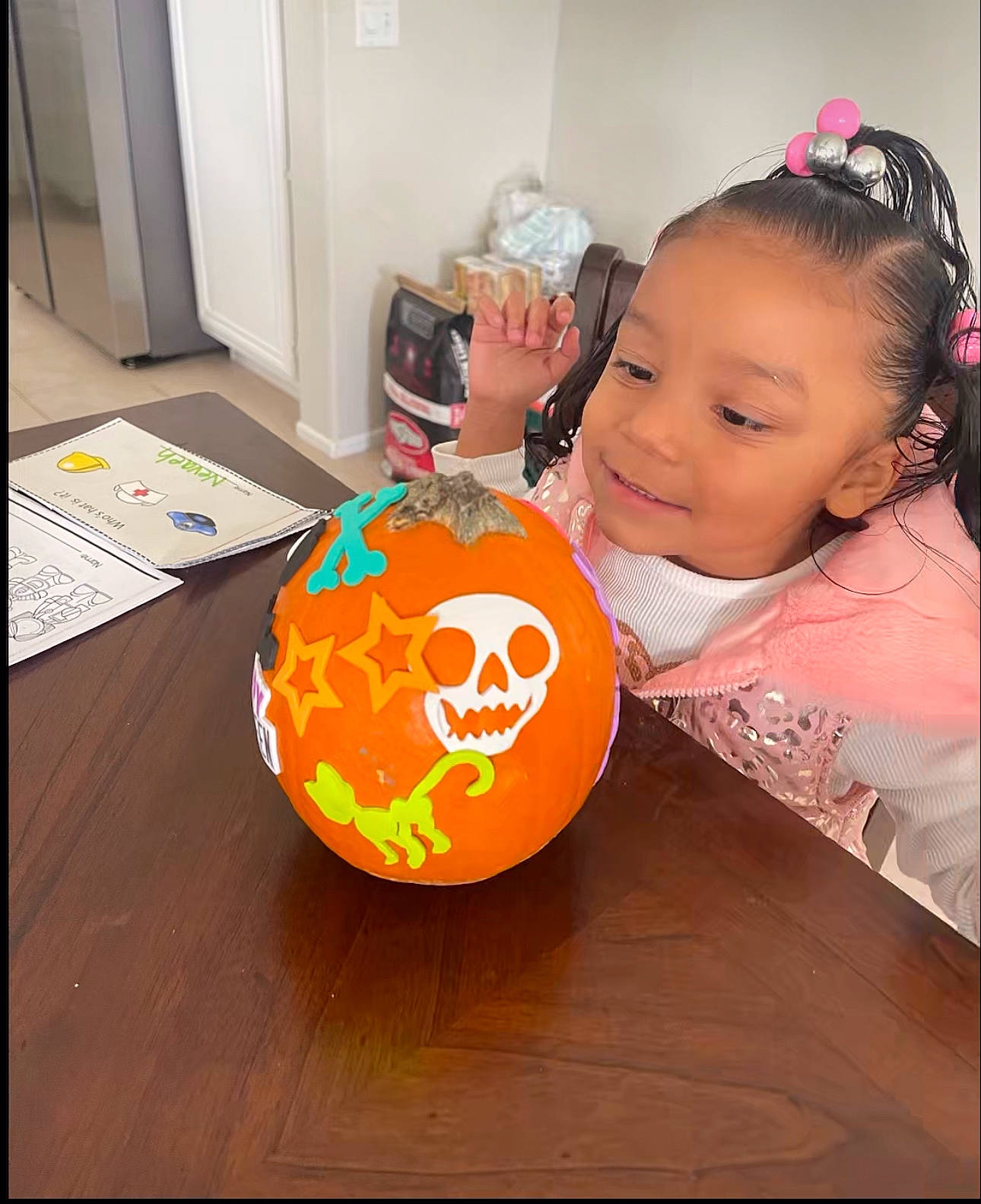 Nevaeh is registered to the contest to win money with this photo: art, baby, baby_toddler_clothing, ball, calabaza, child, circle, flooring, fun, happy, headband, headpiece, joy, party_supply, person, personal_protective_equipment, pumpkin, room, soccer_ball, toddler