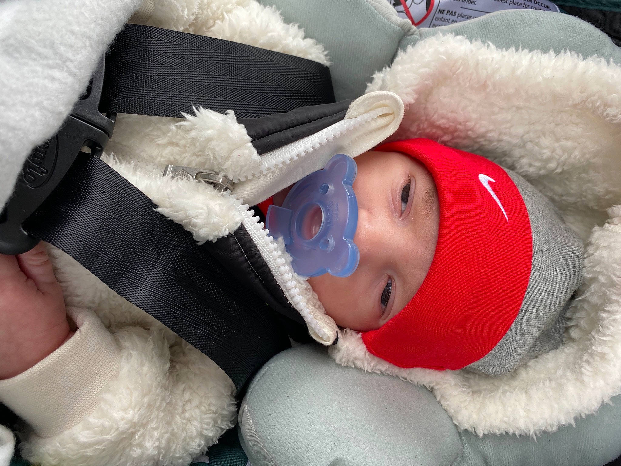 Jayce joined the competition — help win amazing prizes! baby, cap, child, comfort, eye, finger, gesture, hand, hat, head, headgear, headwear, human_body, lip, person, plush, skin, smile, stuffed_toy, textile