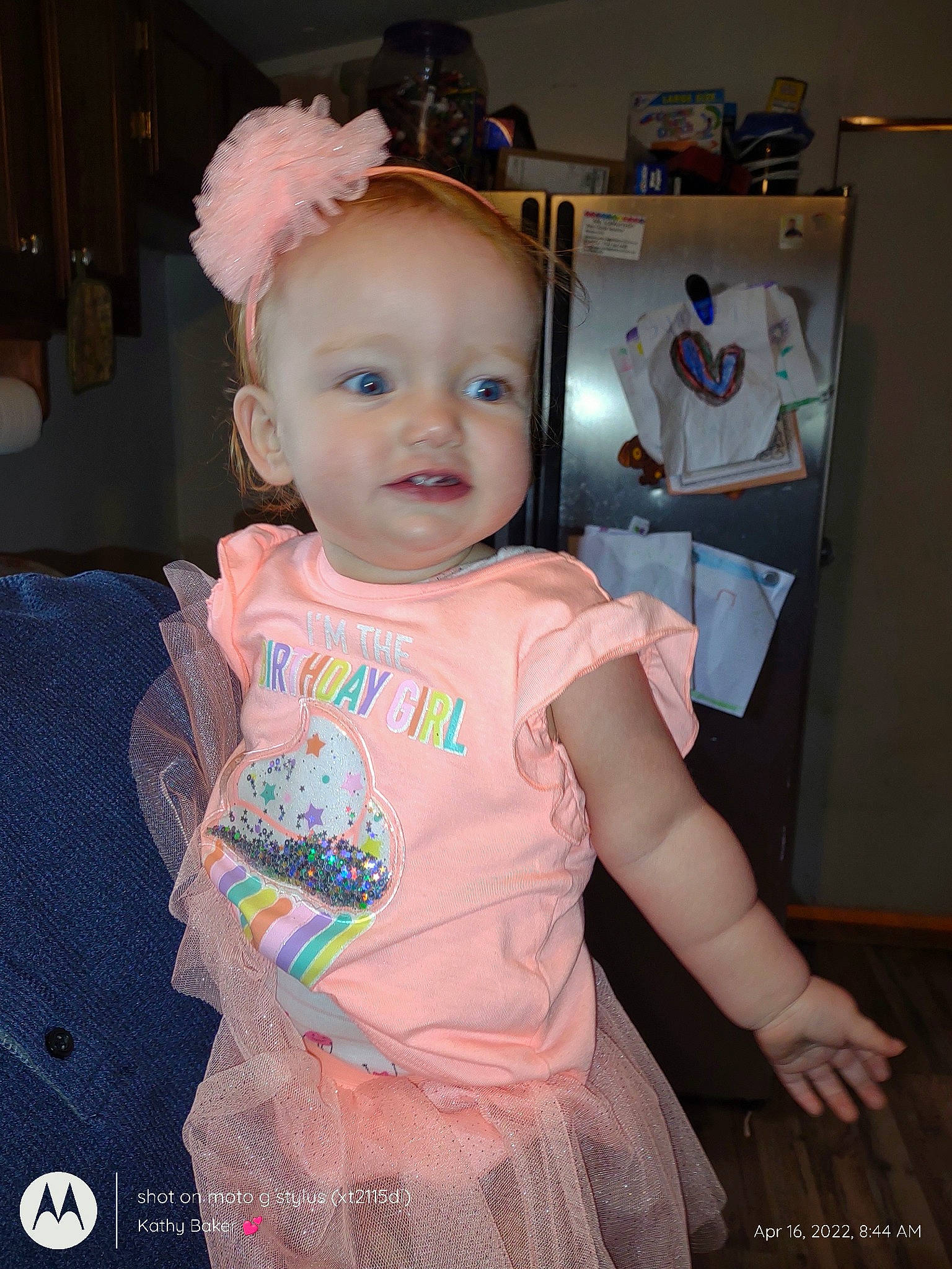 Riley is registered to the contest to win money with this photo: baby, baby_toddler_clothing, cheek, child, costume, costume_hat, day_dress, event, fashion_accessory, fun, happy, hat, iris, jewellery, one_piece_garment, pattern, person, pink, smile, t_shirt