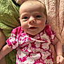 Lainey joined the competition — help win amazing prizes! baby, infant, tie_dye_clothing, pink_clothing, green_blanket, pink_blanket, soft_texture, smiling, face, head, skin, arm, hand, person, portrait, close_up, indoor, cute, newborn, cozy