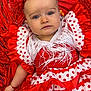 baby, blue_eyes, child, clothing, colorful, cute, dress, flower, fringe, happy, headband, infant, laying_down, polka_dot, portrait, red, ruffles, shawl, traditional, white