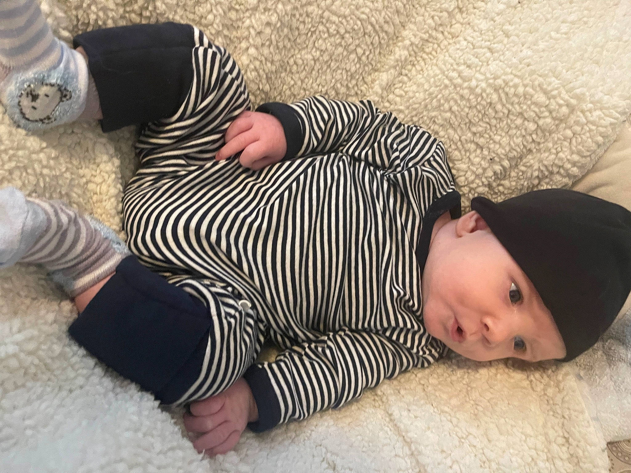 Jameson joined the competition — help win amazing prizes! baby, baby_toddler_clothing, child, clothing, comfort, finger, flooring, foot, grass, headwear, human_leg, joint, leg, mammal, pattern, person, skin, sleeve, thumb, toddler
