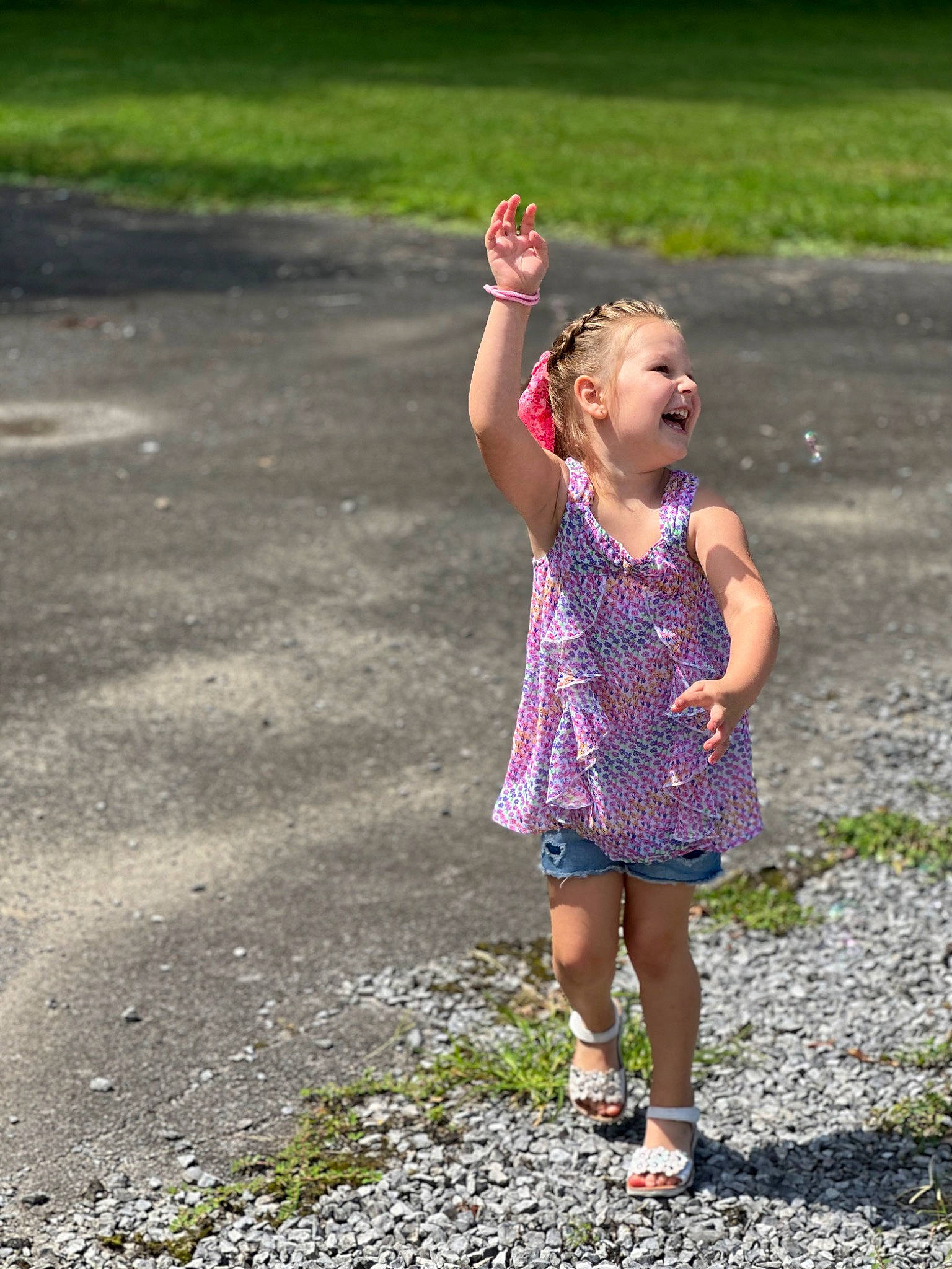 Harley joined the competition — help win amazing prizes! asphalt, child, day_dress, dress, fun, gesture, grass, hair, happy, human_body, joy, leisure, magenta, people_in_nature, person, plant, recreation, road, road_surface, sandal