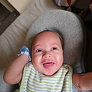 Jamir joined the competition — help win amazing prizes! baby, infant, smiling, bib, mittens, face, person, indoor, happy, child, cute, expression, clothing, seat, head, skin, closeup, portrait, newborn, comfort