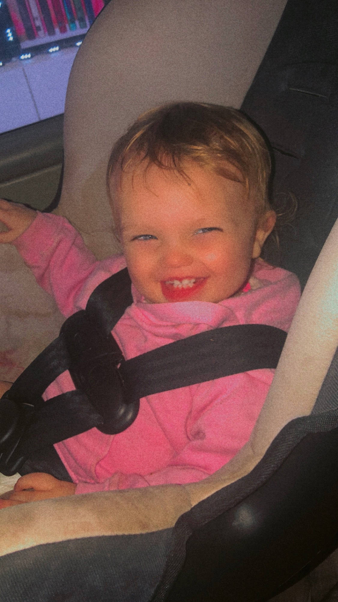 Jayla is registered to the contest to win money with this photo: arm, auto_part, car_seat, chair, cheek, child, comfort, facial_expression, finger, happy, joy, lap, person, pink, product, sitting, skin, smile, thumb, tints_and_shades