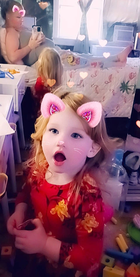 Angel is registered to the contest to win money with this photo: baby, bangs, brown_hair, chair, cheek, child, ear, event, eyelash, fashion_accessory, fun, hair, happy, headband, headpiece, person, pink, purple, surprise, table