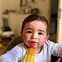 Sohan a rejoint le concours — aidez-le/la à gagner de superbes lots ! toddler, child, popsicle, food, face, rosy_cheeks, indoor, curious, brown_hair, white_clothing, closeup, portrait, happy, cute, sweet, summer, snack, young_child, innocence, blurred_background