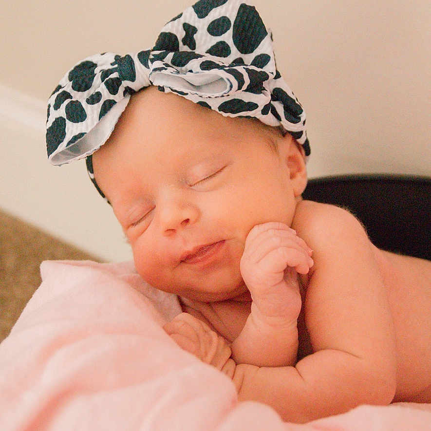 Presleigh is registered to the contest to win money with this photo: baby, bodypart, bonnet, cap, clothing, face, finger, hand, hat, head, newborn, person, photography, portrait, scarf, sleeping
