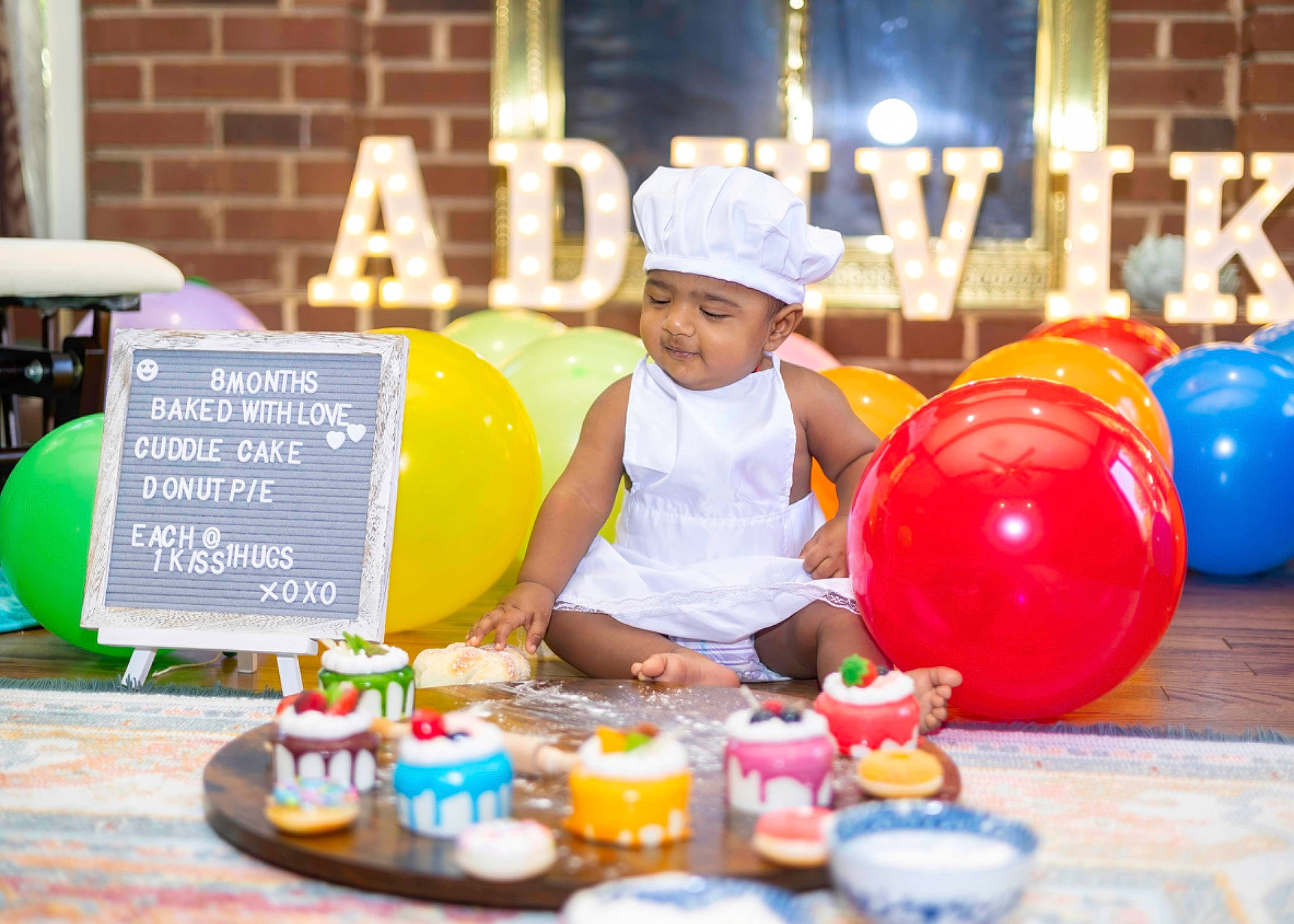 Adhvik joined the competition — help win amazing prizes! balloon, child, city, event, fun, games, hat, headwear, kindergarten, leisure, party, party_supply, person, plastic, play, recreation, room, sitting, table, toddler