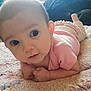 Sylvia is registered to the contest to win money with this photo: baby, infant, child, tummy_time, blanket, pink_clothes, onesie, ruffles, hands, face, big_eyes, cute, portrait, lying_down, soft_texture, carpet, indoors, close_up, gaze, adorable