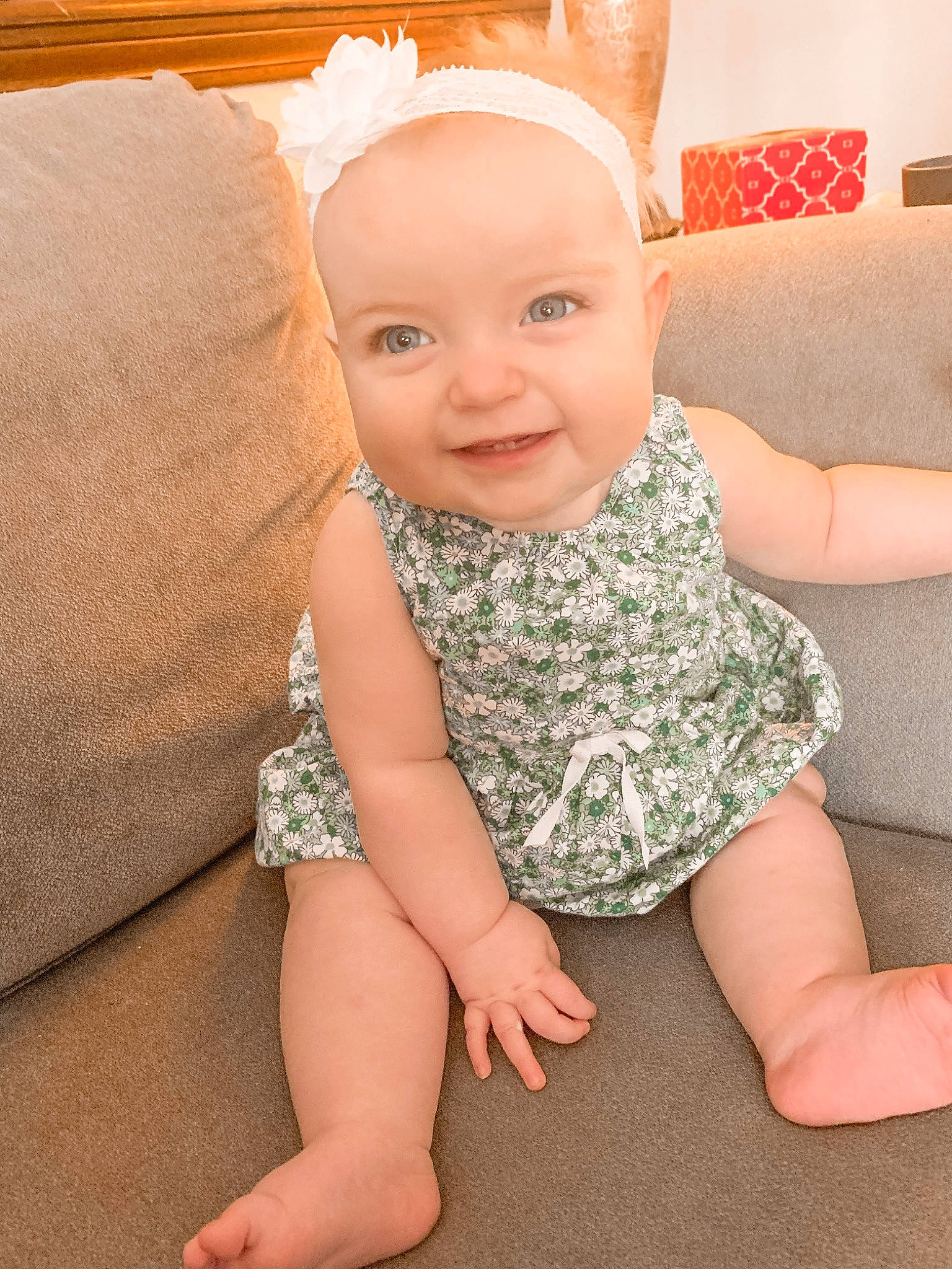 Lorelai joined the competition — help win amazing prizes! baby, baby_toddler_clothing, child, dress, ear, face, head, joy, leg, pattern, person, pink, sitting, skin, smile, toddler