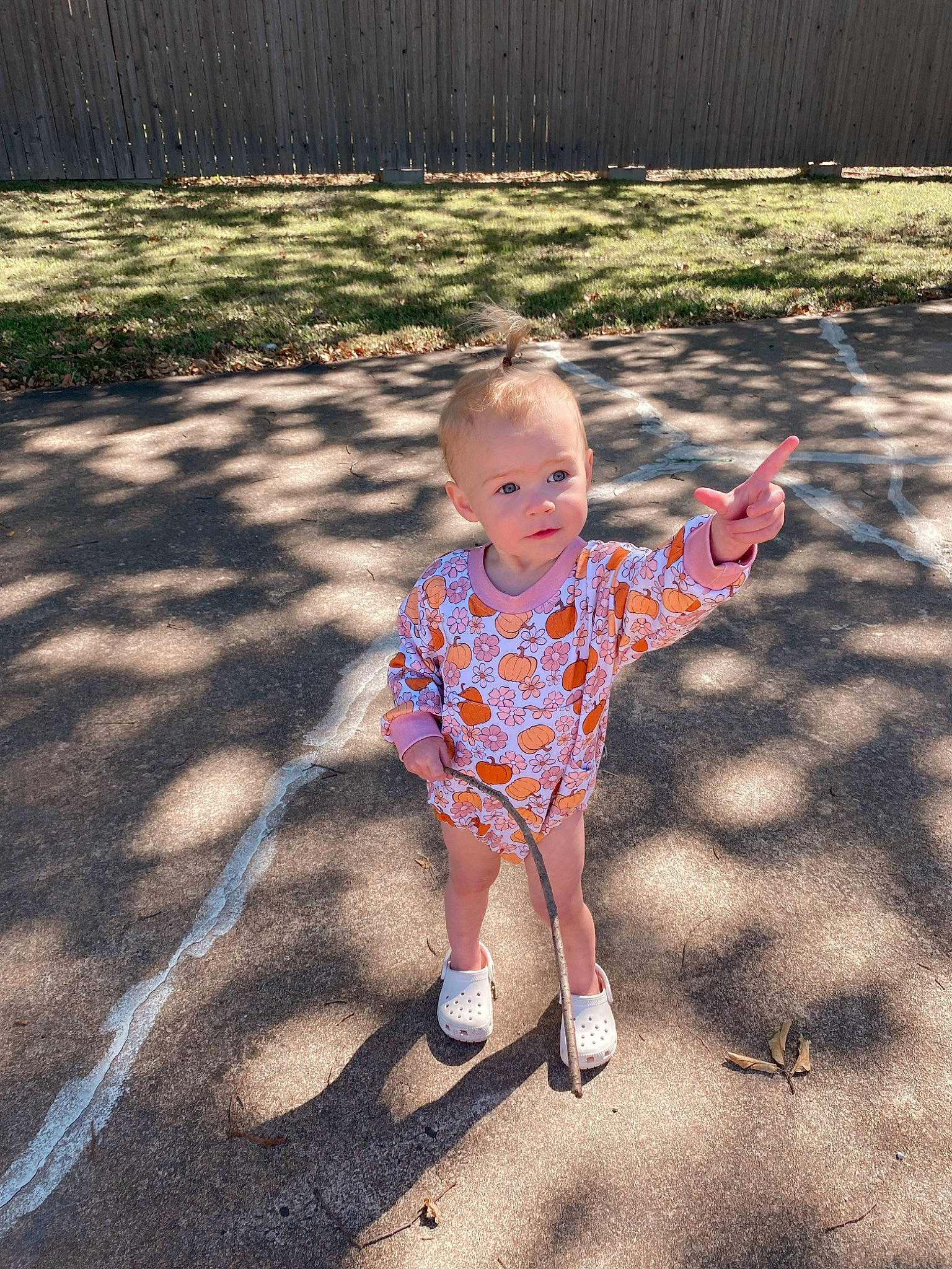 Harper Rae is registered to the contest to win money with this photo: asphalt, baby, baby_toddler_clothing, child, facial_expression, fun, grass, happy, leaf, leisure, mammal, pattern, people_in_nature, person, public_space, road_surface, sleeve, sunlight, tints_and_shades, toddler