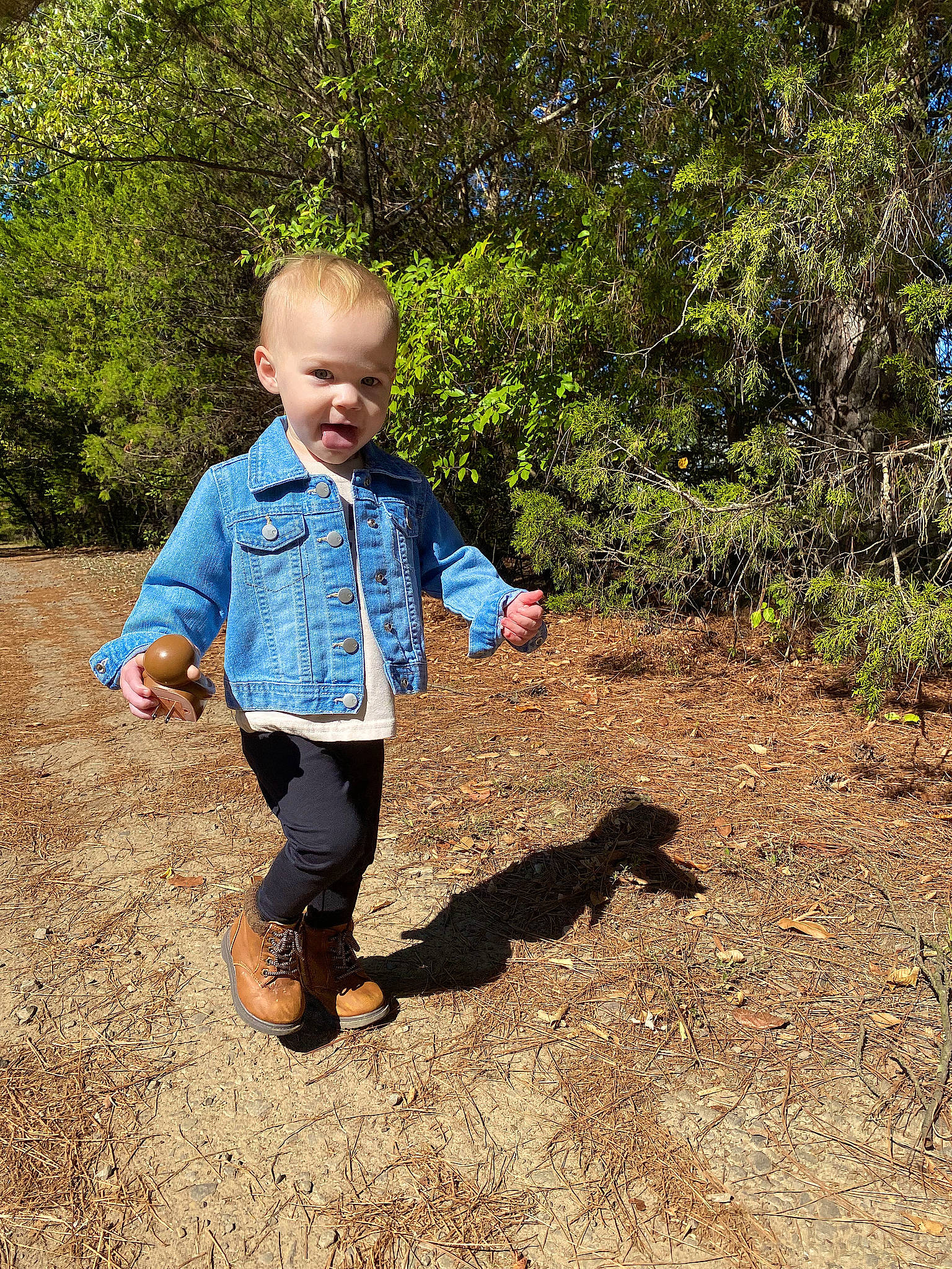 Harper Rae is registered to the contest to win money with this photo: child, denim, electric_blue, fun, garden, grass, happy, landscape, leisure, people_in_nature, person, plant, play, shadow, shoe, sitting, smile, soil, toddler, tree