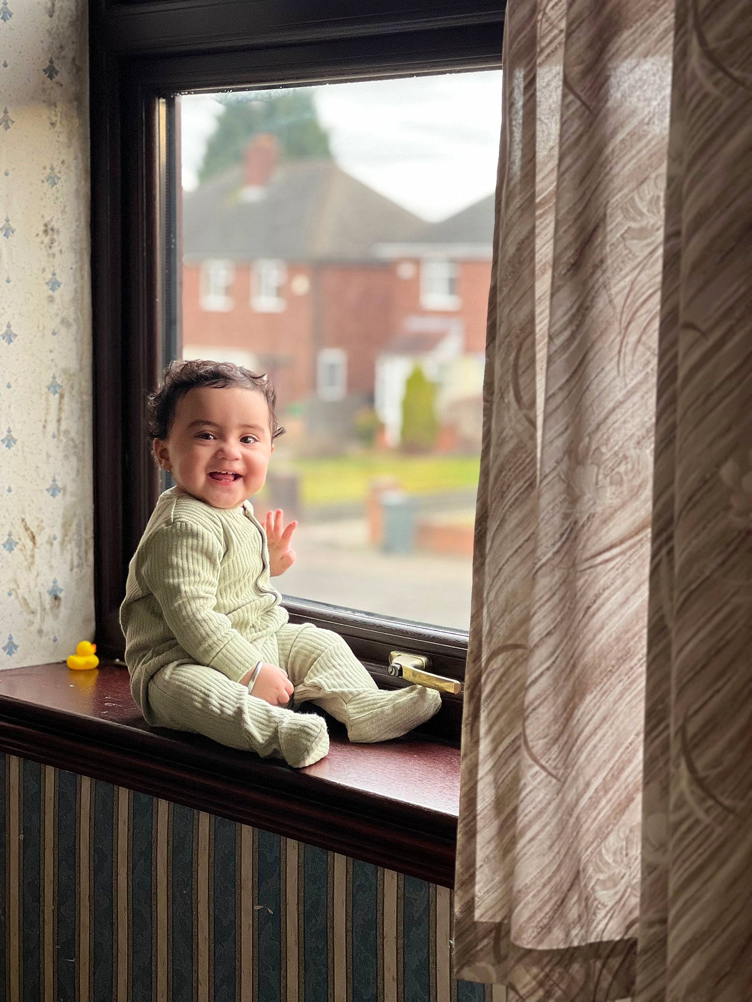 Jaiveer is registered to the contest to win money with this photo: baby, baby_toddler_clothing, comfort, flooring, fun, happy, jacket, joy, leisure, person, portrait_photography, room, sitting, sleeve, smile, tints_and_shades, toddler, vacation, window, wood