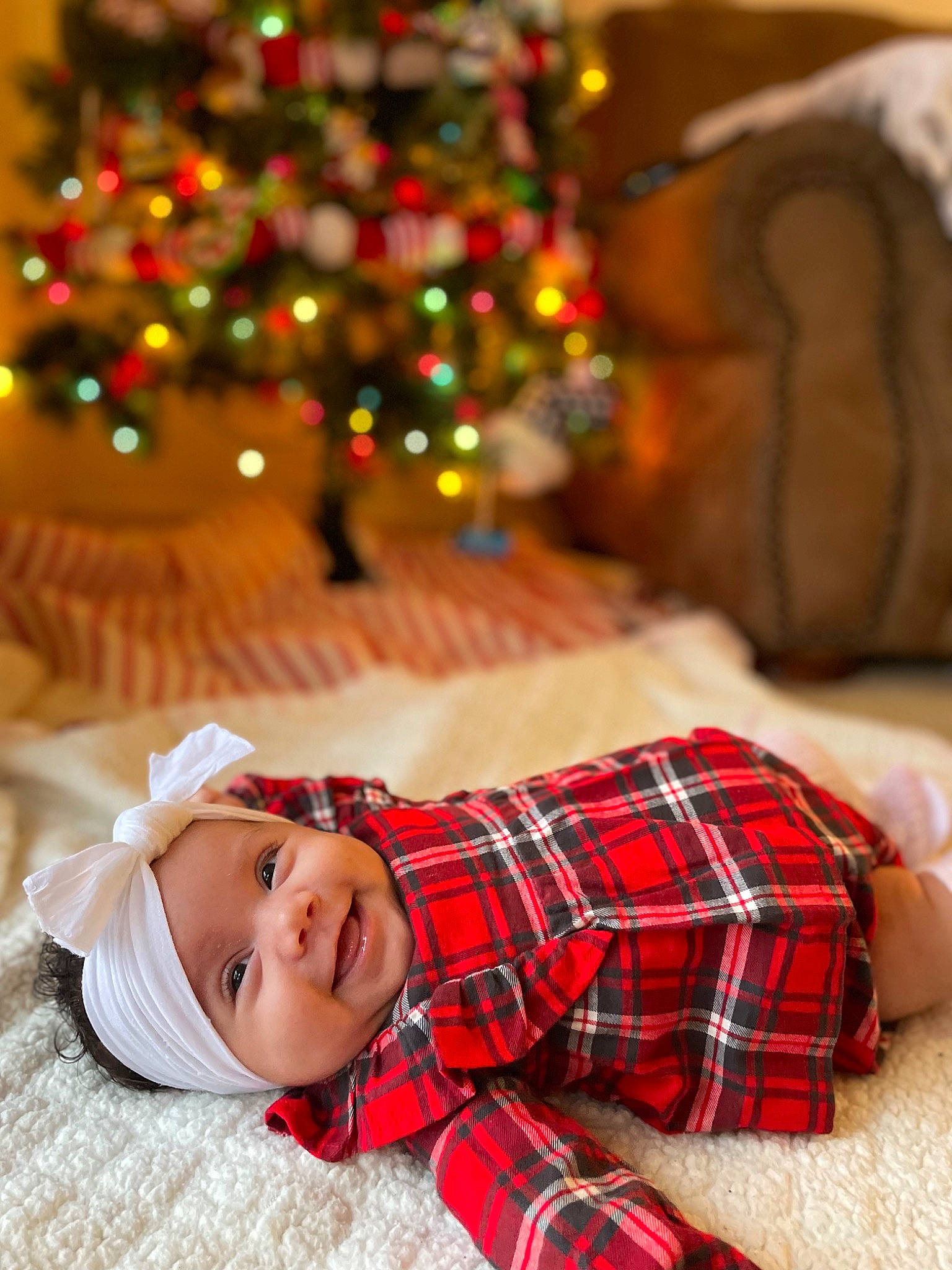 Jordyn joined the competition — help win amazing prizes! child, christmas, christmas_decoration, christmas_ornament, christmas_tree, comfort, event, green, happy, head, headwear, holiday_ornament, joy, ornament, pattern, person, plaid, sleeve, smile, tartan