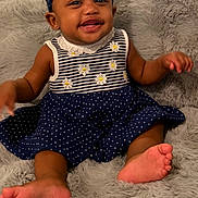 Allison joined the competition — help win amazing prizes! baby, child, smiling, sitting, portrait, indoor, blanket, fluffy_blanket, dress, headband, polka_dots, flowers, navy_blue, gray, bare_feet, happy, infant, furniture, home, photography