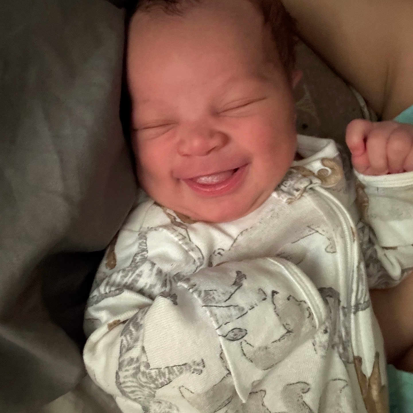 Qwes is registered to the contest to win money with this photo: animal_print, baby, child, clothing, cozy, cute, face, hand, happy, indoors, infant, newborn, onesie, peaceful, portrait, resting, sleeping, smiling, soft_lighting, toddler