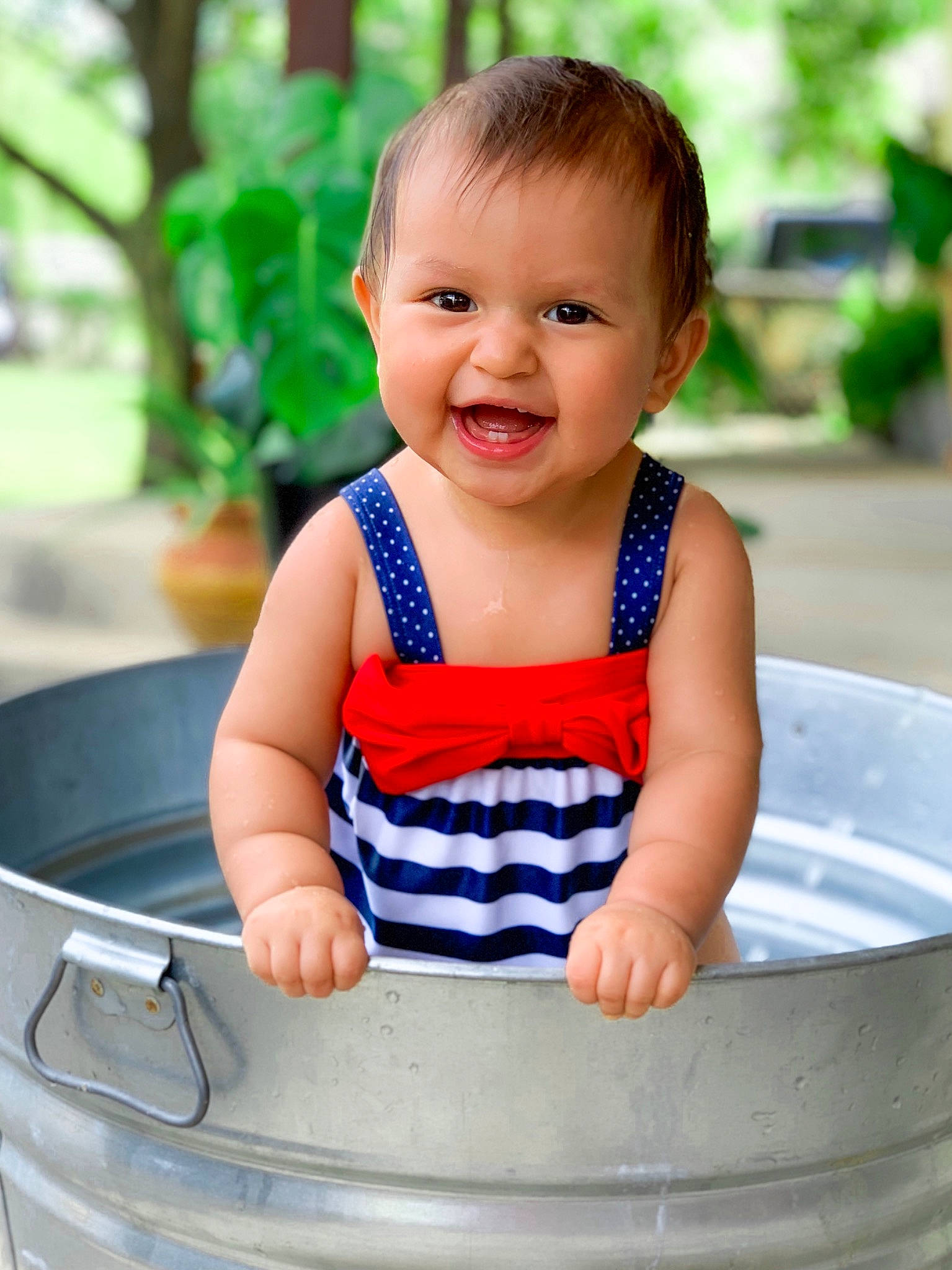 Amilia Perez is registered to the contest to win money with this photo: baby, baby_bathing, baby_products, bathing, beauty, child, face, joy, leisure, person, play, product, recreation, sitting, skin, smile, toddler, water
