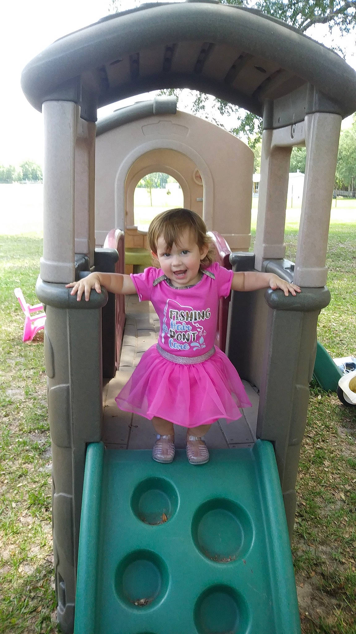 Abigail is registered to the contest to win money with this photo: child, fun, outdoor_play_equipment, person, pink, play, playground, playset, public_space, recreation, toddler