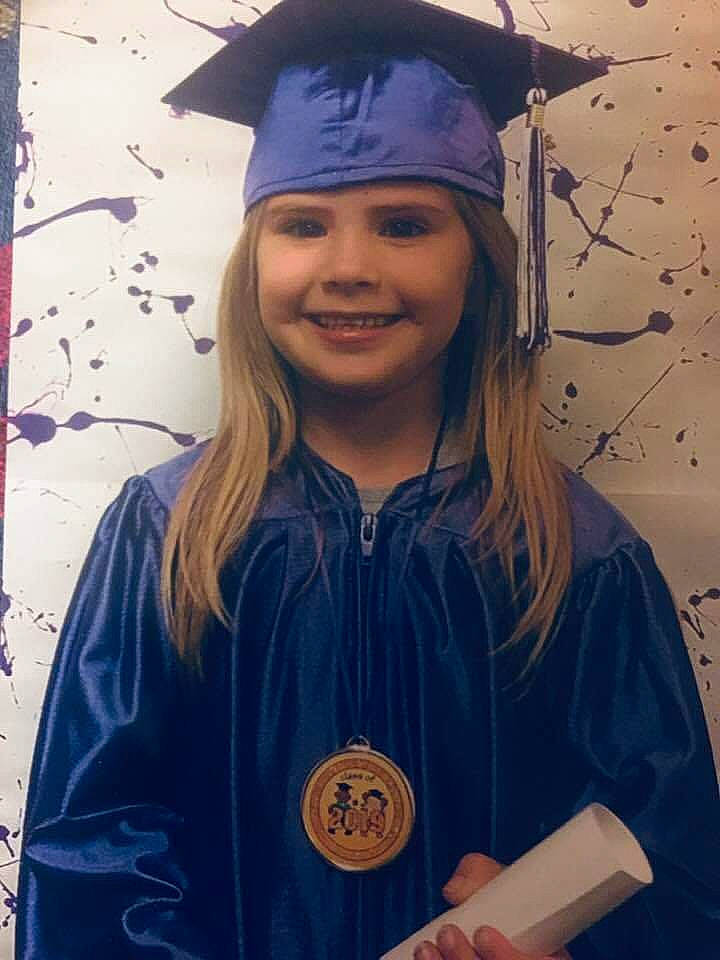 Kelley is registered to the contest to win money with this photo: academic_dress, clothing, diploma, event, graduation, headgear, headwear, joy, mortarboard, person, phd, scholar, smile, student