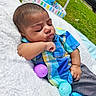 Jayden is registered to the contest to win money with this photo: baby, balloon, blanket, bodypart, car, face, finger, grass, hand, head, machine, outdoors, person, photography, plant, portrait, sphere, transportation, vehicle, wheel