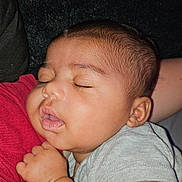 Jayden is registered to the contest to win money with this photo: baby, bodypart, clothing, couch, ear, face, finger, furniture, hand, head, mouth, newborn, person, photography, portrait, sleeping, t_shirt, toe, wrist