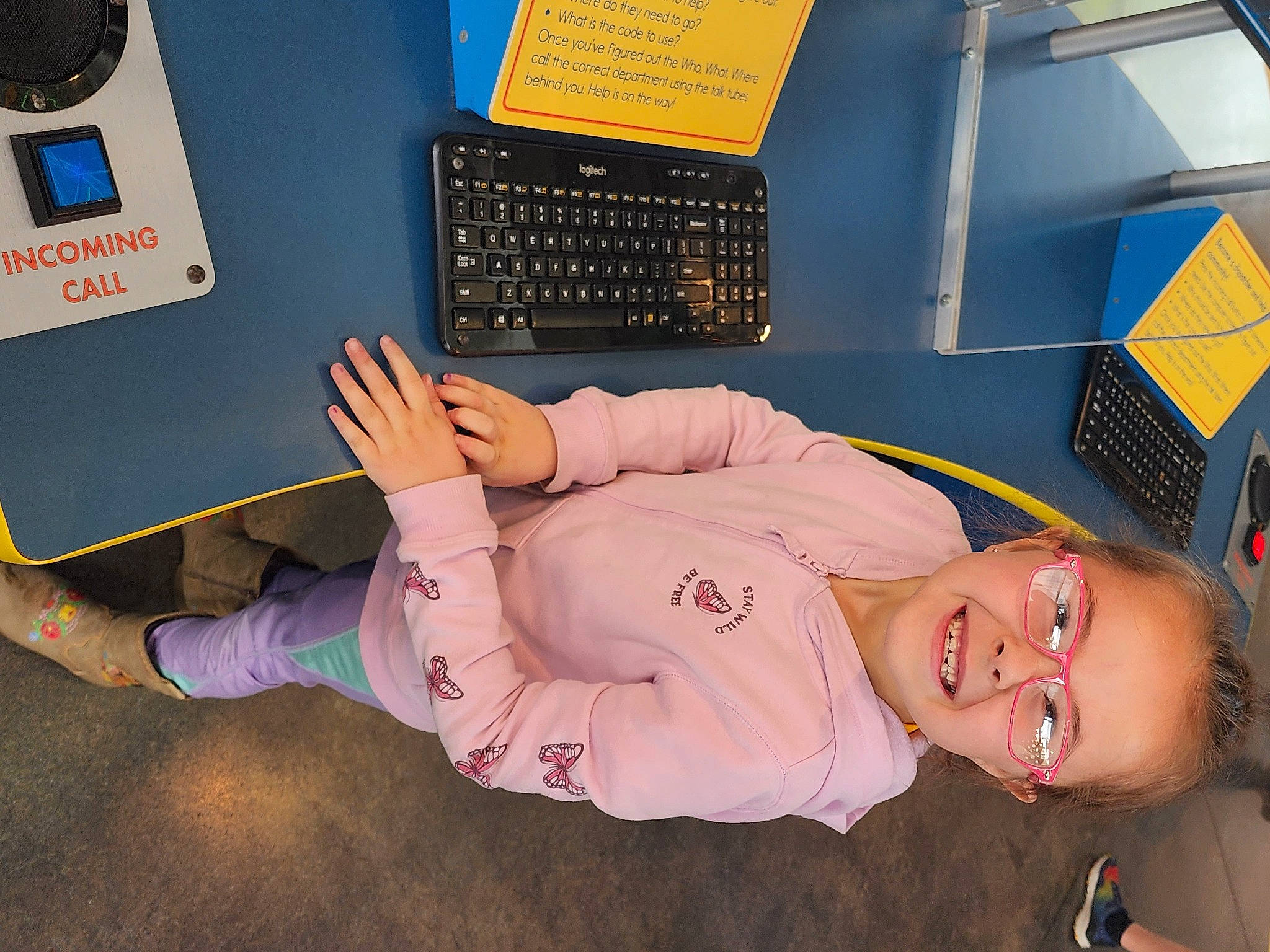 Gabrielle is registered to the contest to win money with this photo: baby_toddler_clothing, child, comfort, elbow, finger, flooring, gesture, human_leg, job, joy, knee, machine, office_equipment, office_supplies, person, room, service, smile, space_bar, thumb