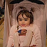 Nurbanu is registered to the contest to win money with this photo: toddler, child, stroller, pink, sweater, pigtails, seatbelt, indoor, cute, smile, hair, baby, clothing, person, seat, sitting, face, young_child, childrens_fashion, casual