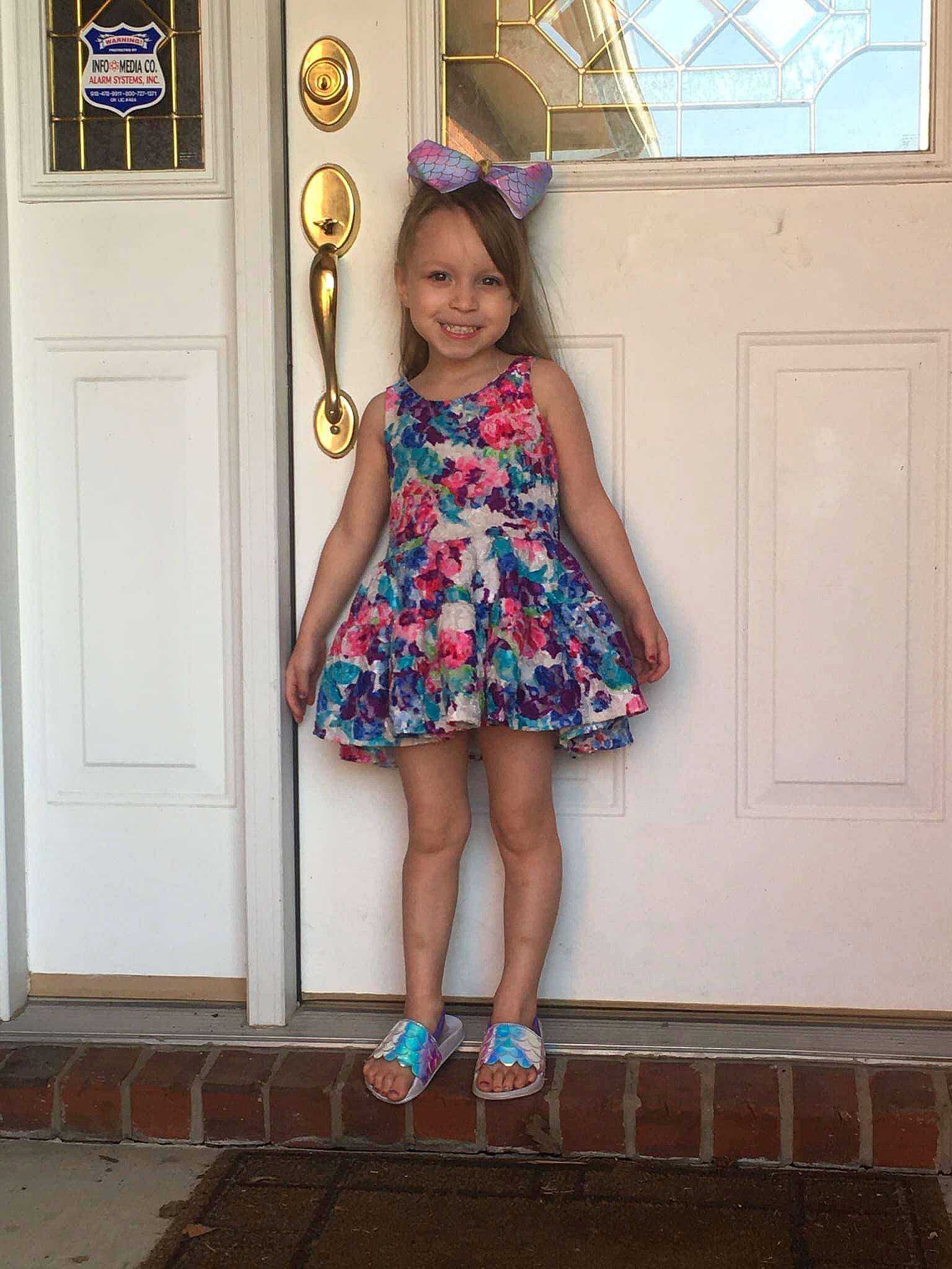 Remington is registered to the contest to win money with this photo: azure, beauty, blue, day_dress, door, dress, electric_blue, fashion_design, human_leg, joy, knee, leg, long_hair, one_piece_garment, person, pink, purple, sleeve, smile, standing