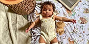 Nomi is registered to the contest to win money with this photo: baby, basket, bed, bedroom, blanket, crib, cushion, face, fun, furniture, head, homedecor, infantbed, leisureactivities, person, photography, picnic, portrait, quilt, sitting