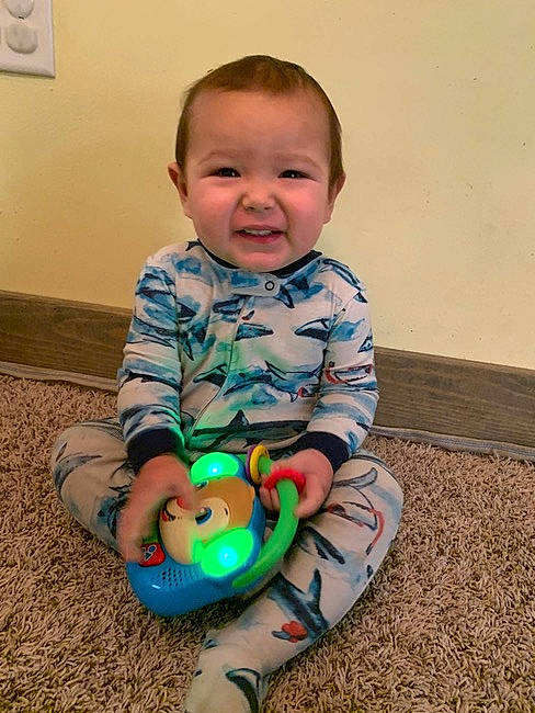 Mateo De Jesus joined the competition — help win amazing prizes! baby, baby_toddler_clothing, cheek, child, eye, fun, grass, happy, head, iris, light_switch, pattern, person, picture_frame, sitting, skin, sleeve, smile, toddler, wall_plate