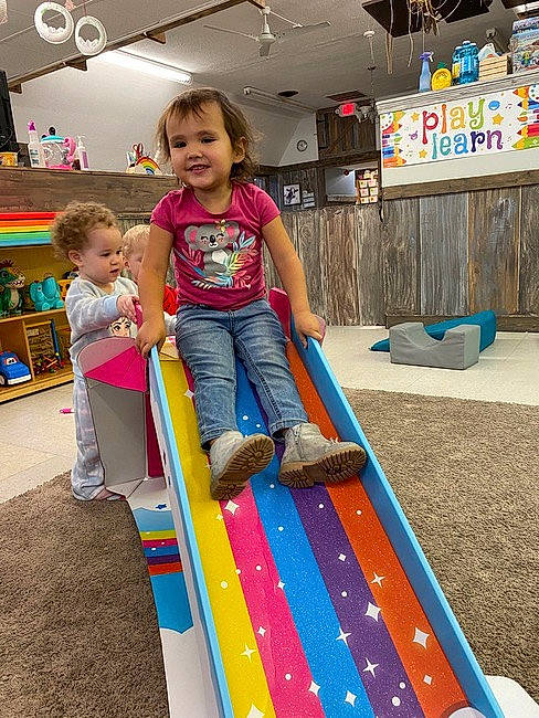 Selena is registered to the contest to win money with this photo: child, city, electric_blue, fun, games, grass, happy, joy, leisure, outdoor_play_equipment, person, play, playground, recreation, sharing, shorts, smile, summer, t_shirt, toddler