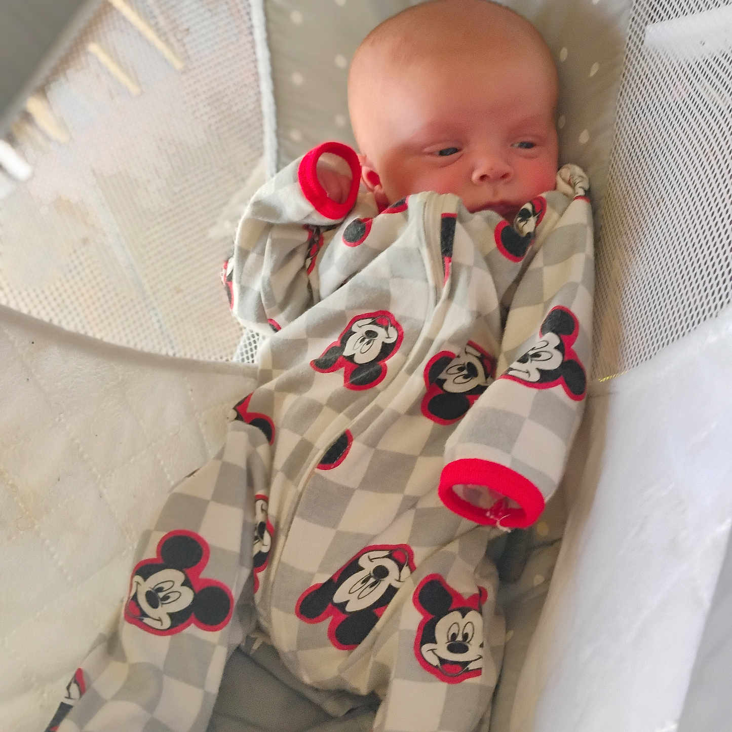 Alexander is registered to the contest to win money with this photo: applique, baby, bed, blanket, clothing, couch, cradle, crib, dress, face, furniture, head, hosiery, infantbed, newborn, pajamas, pattern, person, sock