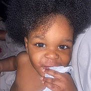 Marcus joined the competition — help win amazing prizes! toddler, child, afro_hair, baby, curious, close_up, face, hand, skin, eyes, indoor, portrait, cute, expression, infant, person, young_child, fingers, cloth, holding