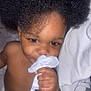 Marcus is registered to the contest to win money with this photo: toddler, child, afro_hair, baby, diaper, hand, face, eyes, skin, bedding, cloth, soft, cute, closeup, indoor, portrait, expression, playful, curious, infant