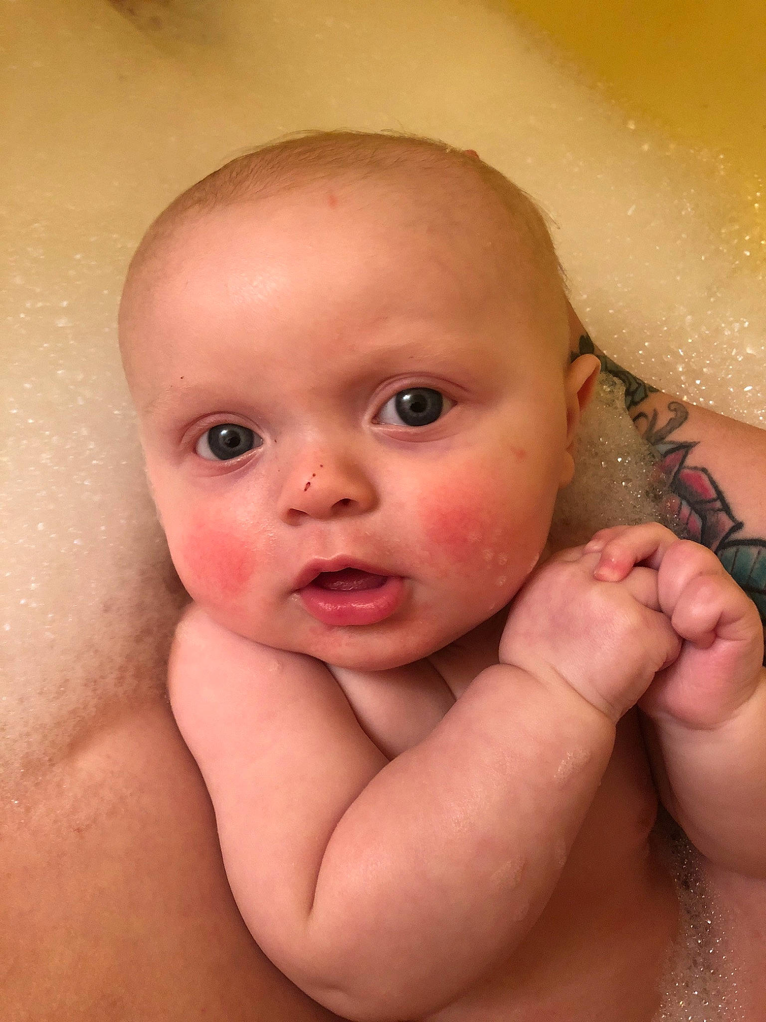 Kamren is registered to the contest to win money with this photo: baby, baby_bathing, bathing, cheek, child, chin, close_up, eye, eyebrow, face, finger, forehead, hand, head, lip, mouth, muscle, nose, person, skin