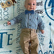Theodore joined the competition — help win amazing prizes! baby, infant, boy, blue_shirt, bow_tie, khaki_pants, barefoot, toy_airplane, blanket, name_text, personalized_blanket, lying_down, portrait, cute, smiling, child, indoors, clothing, face, young