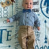 baby, infant, boy, blue_shirt, bow_tie, khaki_pants, barefoot, toy_airplane, blanket, name_text, personalized_blanket, lying_down, portrait, cute, smiling, child, indoors, clothing, face, young