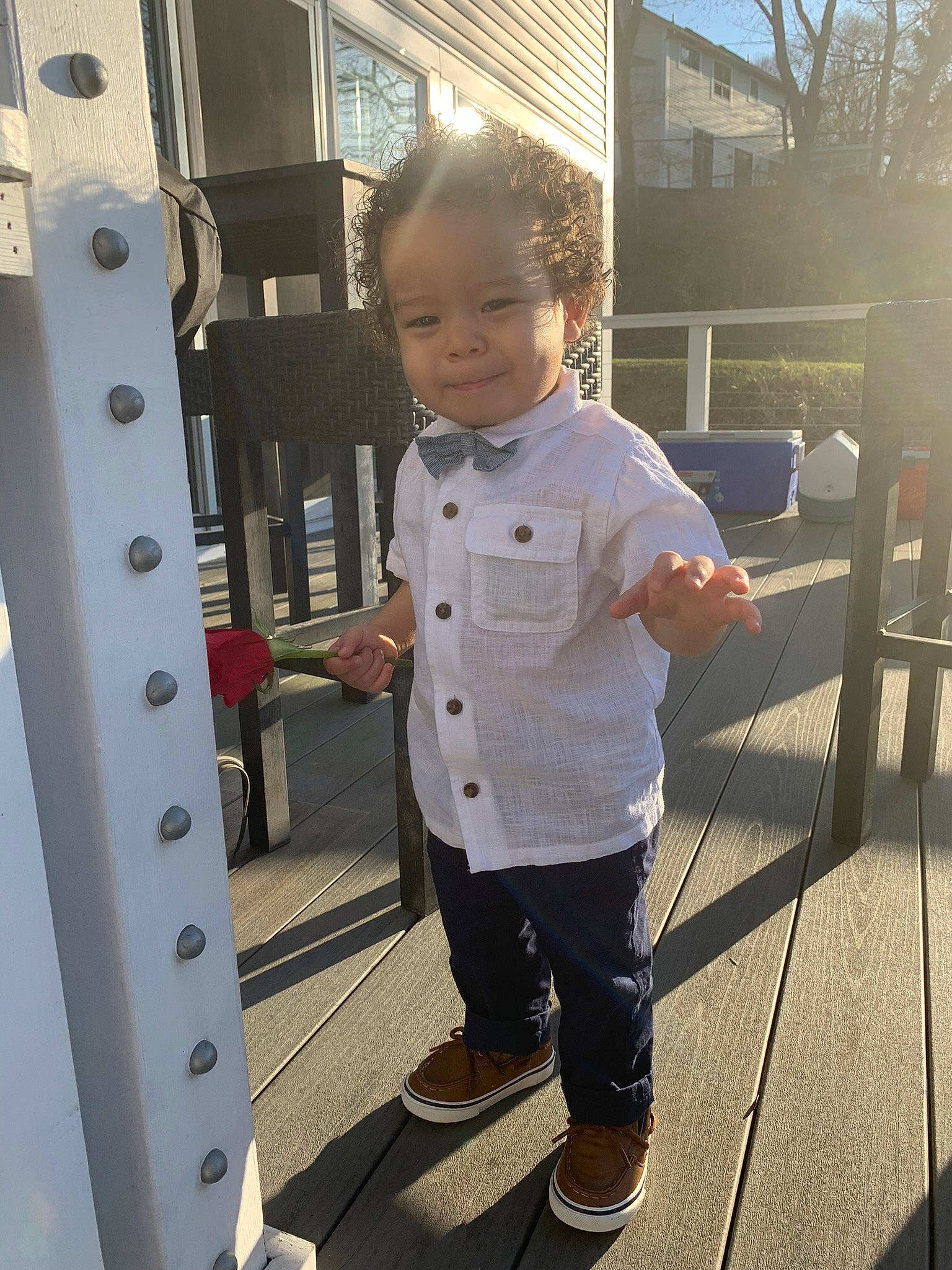 Royce is registered to the contest to win money with this photo: chair, child, denim, door, engineering, fun, gas, happy, leisure, machine, metal, person, sandal, shorts, standing, t_shirt, toddler, tree, vacation, wood