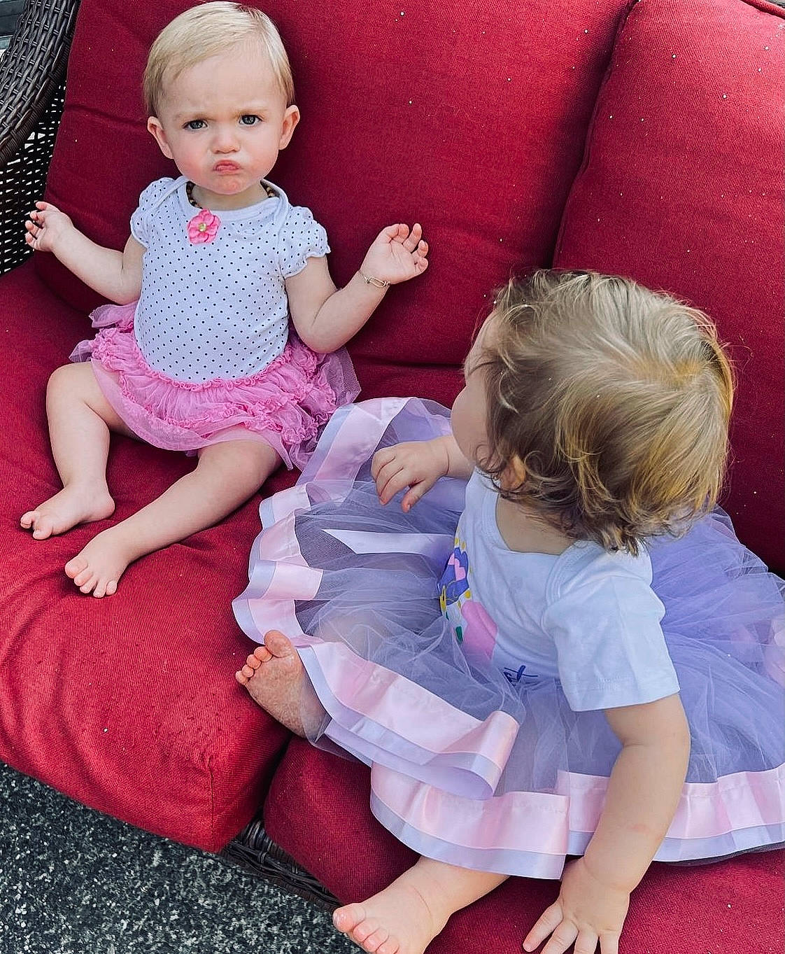 Beyla is registered to the contest to win money with this photo: arm, baby_toddler_clothing, comfort, dress, finger, fun, gesture, hairstyle, happy, head, human_body, lap, leg, person, pink, purple, skin, sleeve, sock, sorrow