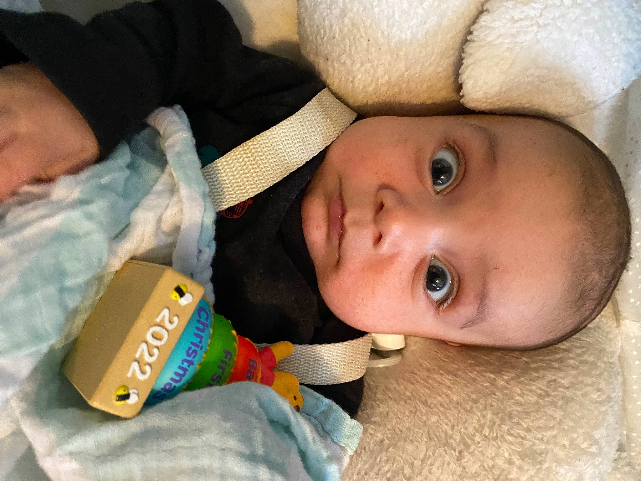 Jesse is registered to the contest to win money with this photo: baby, baby_products, baby_toddler_clothing, cheek, child, comfort, eyelash, happy, headgear, linens, lip, mouth, nose, person, plastic, portrait_photography, room, skin, smile, toddler