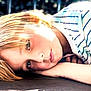 Hunter joined the competition — help win amazing prizes! child, blonde_hair, striped_shirt, face, portrait, laying_down, outdoor, wood, hand, skin, sunlight, expression, young, casual_clothing, relaxed, daylight, person, closeup, resting, nature