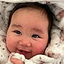 Yurie joined the competition — help win amazing prizes! baby, smiling, blanket, soft, cute, infant, face, happy, cozy, child, wrapped, warm, toddler, hand, portrait, closeup, skin, eyelashes, cheeks, indoors
