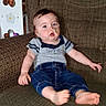 Phoenix is registered to the contest to win money with this photo: baby, child, armchair, clothing, feeding_tube, face, furniture, jeans, person, portrait, shirt, sitting, indoor, patterned, wooden_panel, household_items, curious_expression, foot, hand, taped_tube