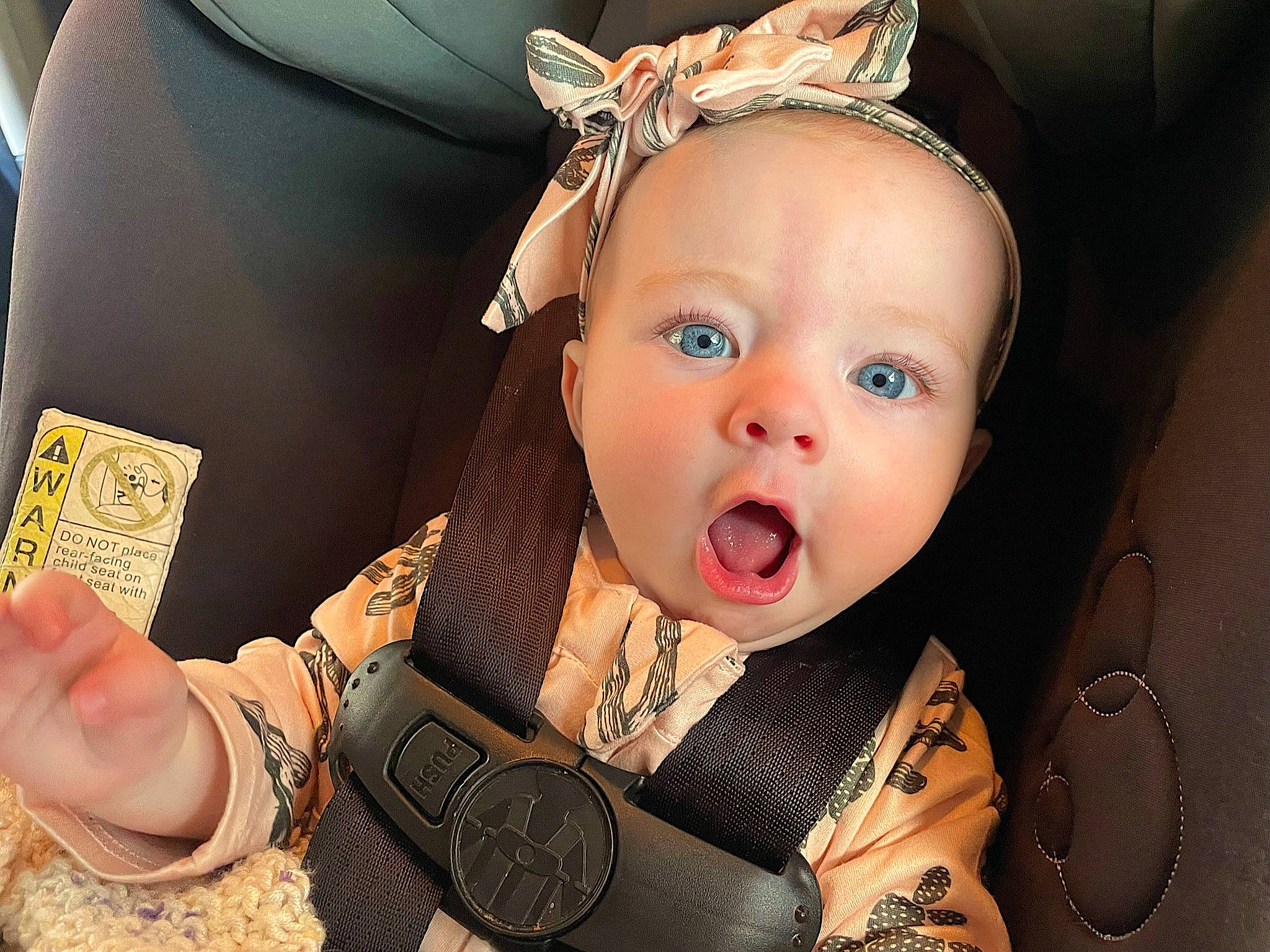 Ellis is registered to the contest to win money with this photo: baby, baby_toddler_clothing, blond, cheek, child, costume_hat, ear, eyelash, fashion_accessory, finger, gesture, happy, headband, headpiece, iris, jewellery, lip, nail, person, skin