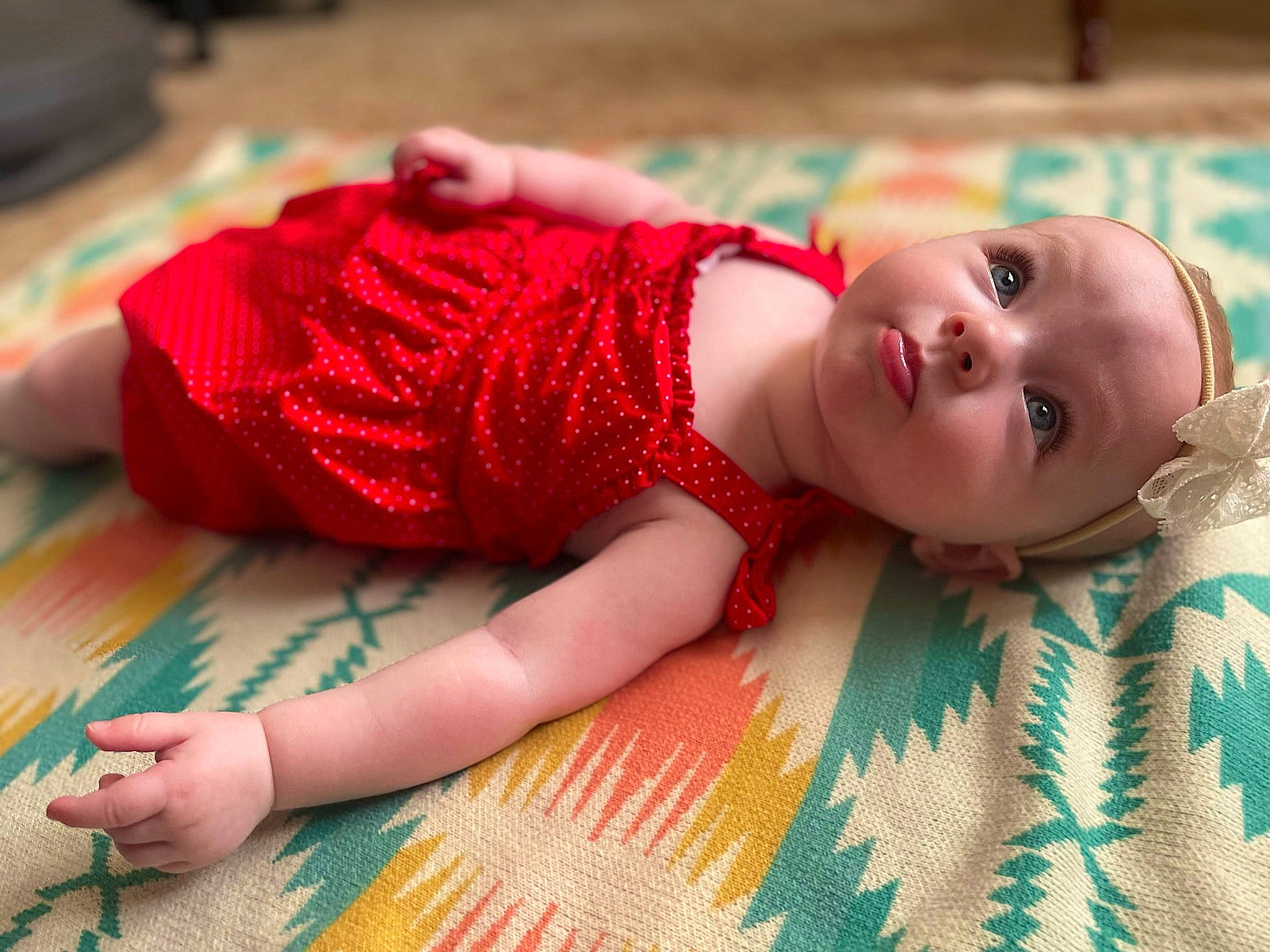 Ellis joined the competition — help win amazing prizes! arm, baby, baby_toddler_clothing, child, eyelash, finger, flooring, grass, head, human_body, human_leg, linens, pattern, person, plaid, skin, sleeve, textile, thigh, toddler