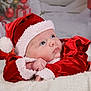 Keyla participe au concours pour gagner de l'argent avec cette photo : baby, infant, santa_hat, christmas, holiday, red_clothing, white_fur, blanket, festive, decorations, presents, cute, portrait, indoors, child, holiday_season, celebration, soft_texture, winter, costume